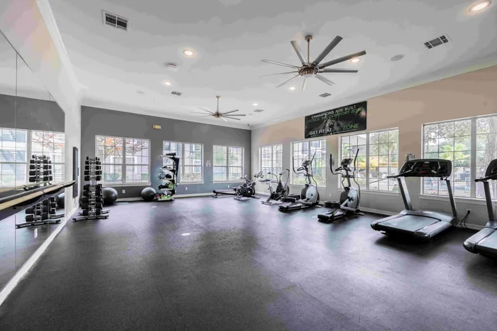 Fitness center with workout equipment at The Zone student apartments near TAMU in College Station Texas