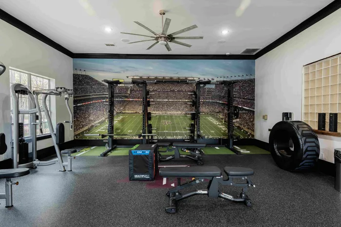24/7 fitness center with cardio machines at The Zone student apartments near TAMU in College Station Texas