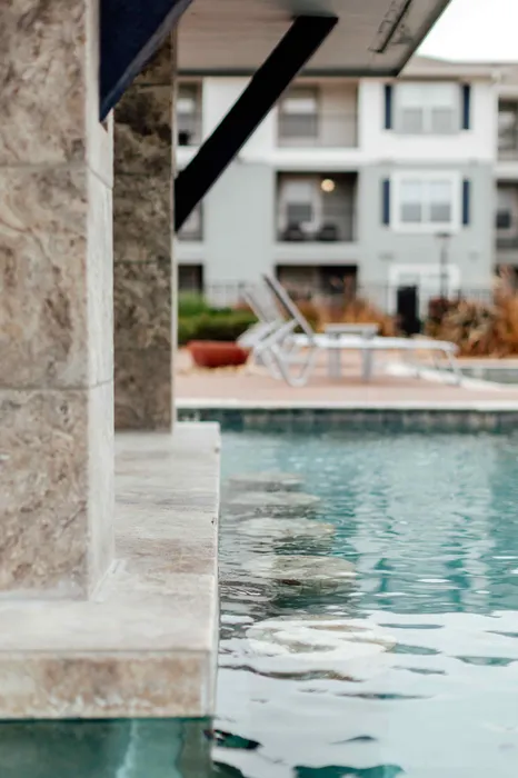 Swim-up bar at the resort-style pool at The Zone student apartments near Texas A&M University in College Station TX