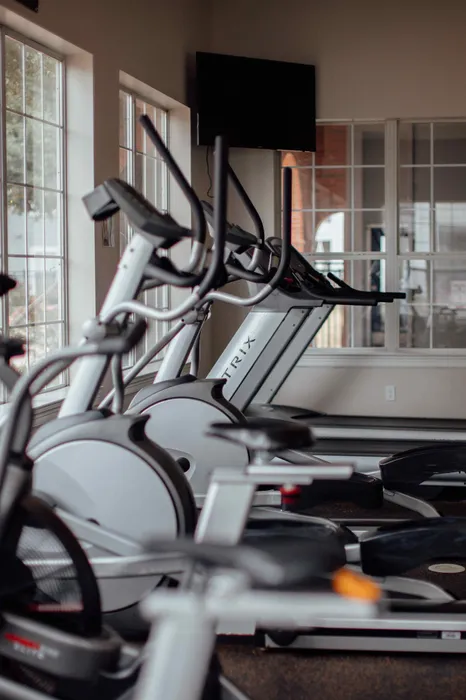 State-of-the-art fitness center with equipment at The Zone student apartments near Texas A&M University in College Station TX