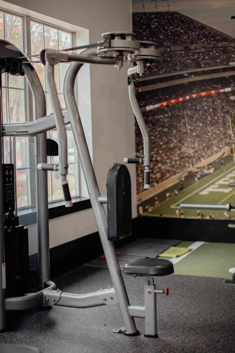 24/7 fitness center with free weights at The Zone student apartments near TAMU in College Station Texas