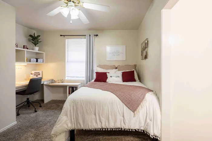 Furnished bedroom at The Zone student apartments near Texas A&M University in College Station Texas