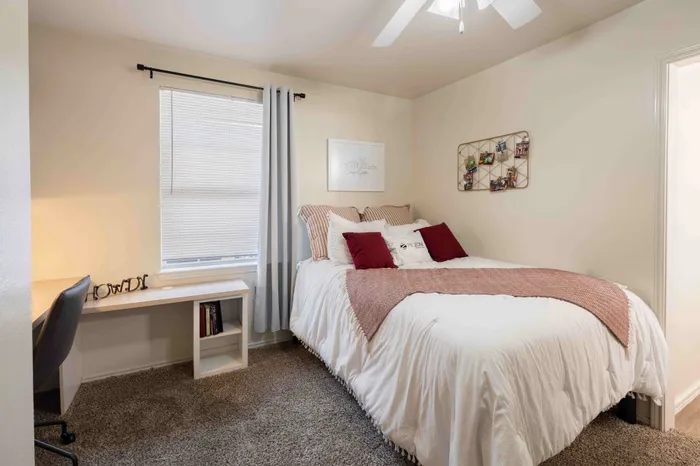 Spacious bedroom with natural light at The Zone student apartments near TAMU in College Station Texas