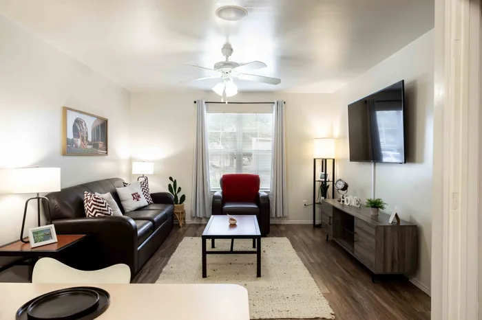 Open living room with hardwood floors at The Zone student apartments near Texas A&M University in College Station TX