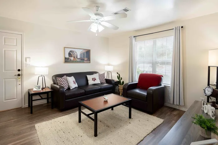Spacious living room interior at The Zone student apartments near Texas A&M University in College Station TX