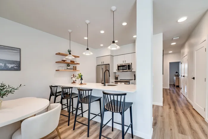 Modern kitchen with high-end appliances and island bar at The Preserve on Goodpasture Eugene Oregon