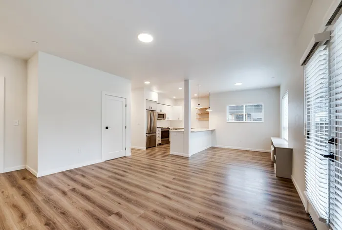 Open-concept living room in 2x2 floor plan at The Preserve on Goodpasture apartments Eugene Oregon