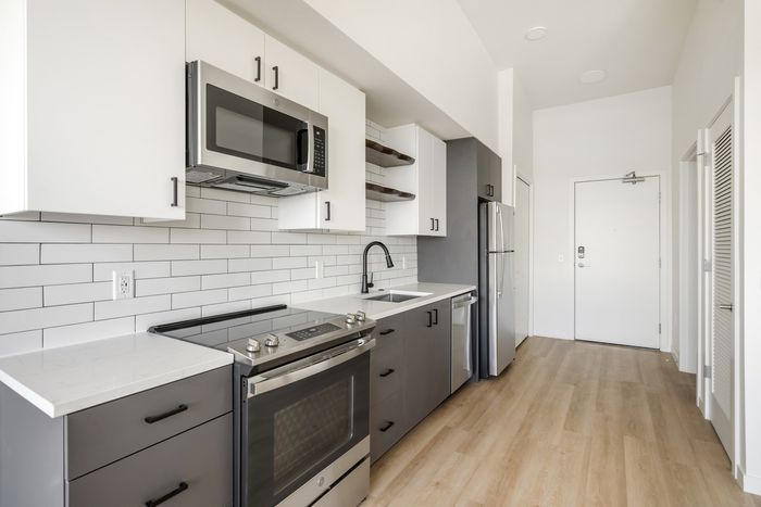 Kitchen in studio apartment homes at The Current in Bend, Oregon