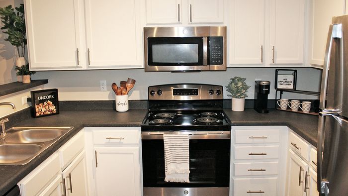 Stylish Centennial Village kitchen with modern appliances, sleek countertops, and elegant cabinetry.