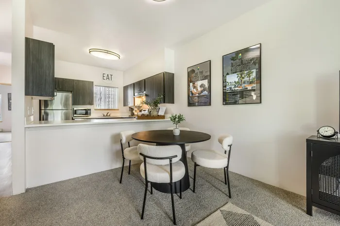 Dining room in model apartment with open floor plan at Chase Village Eugene OR