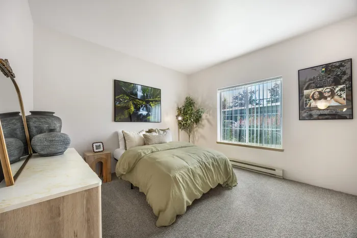 Guest bedroom in model apartment with spacious layout at Chase Village Eugene OR