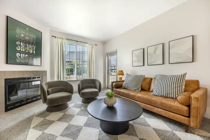 Bright and spacious living room in model apartment at Chase Village apartments in Eugene OR
