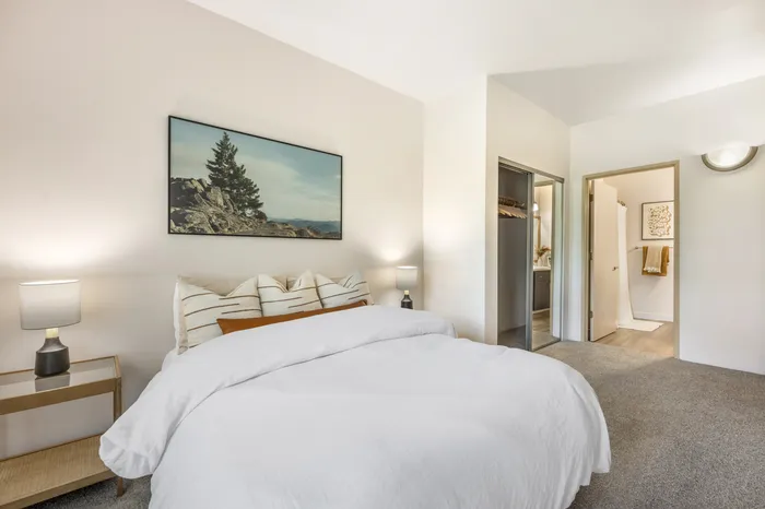 Second view of primary bedroom in model apartment at Chase Village apartments in Eugene OR