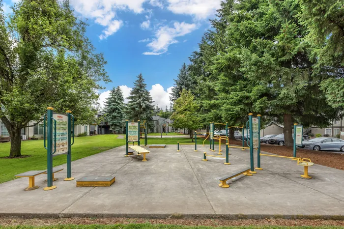 Outdoor fitness area with exercise equipment at Chase Village apartments in Eugene Oregon