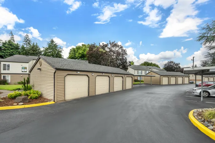 Residential apartment building exterior with landscaping at Chase Village Eugene OR