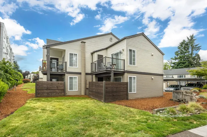 Third residential building exterior showing community grounds at Chase Village Eugene OR