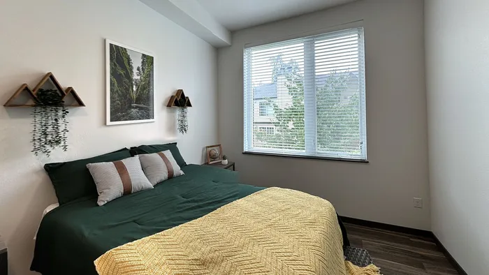 Bright modern bedroom with natural light at The Flats at Chase student apartments in Eugene, OR