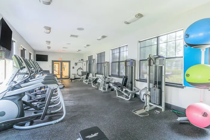 24-7 fitness center with cardio and weight equipment at Corbin Crossing apartments in Overland Park KS