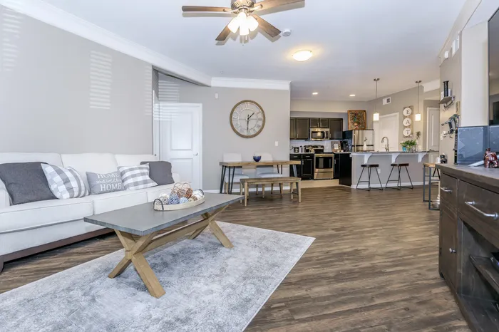 Open-concept model living and dining room with elegant furnishings at Corbin Crossing Overland Park KS