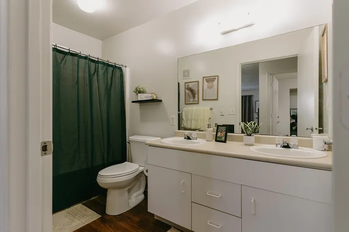 Modern bathroom with dual sinks at Stadium Park student apartments in Eugene OR