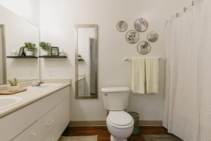 Stylish bathroom with plants and polished fixtures at Stadium Park in Eugene OR