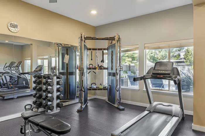 Canyon Springs apartment gym with treadmill weight rack and multi-functional training equipment in Lynnwood Washington