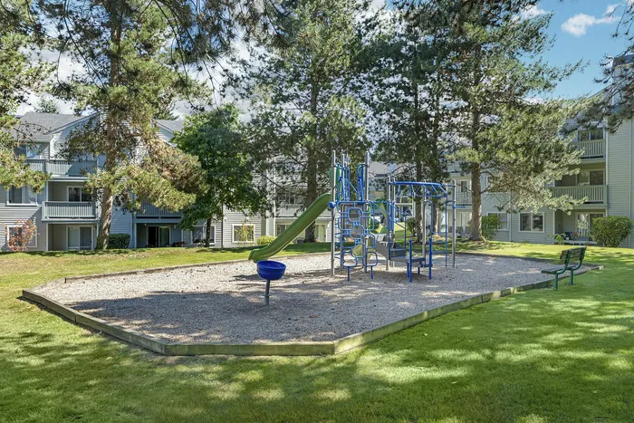 Canyon Springs children's play area nestled among mature trees perfect for family living in Lynnwood WA