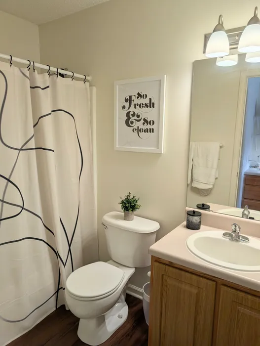 Modern bathroom with stylish vanity and shower at University Suites student apartments in Raleigh NC