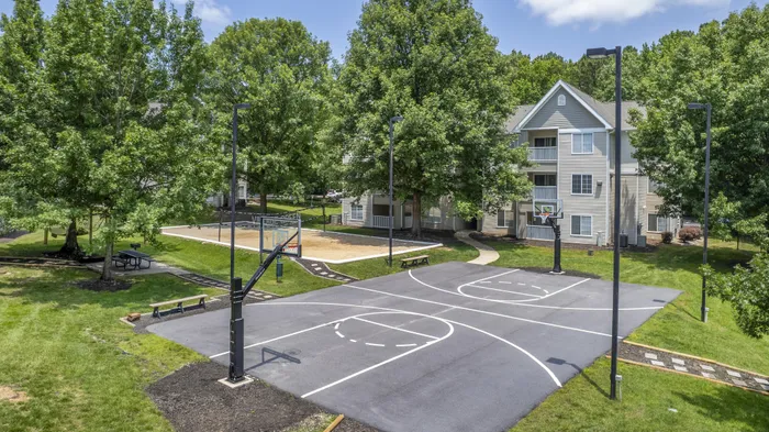 Outdoor basketball court amenity at Village Green student apartments near NC State in Raleigh NC