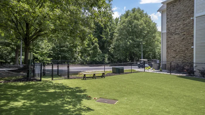 Fenced dog park for residents at Village Green NCSU student apartments in Raleigh NC