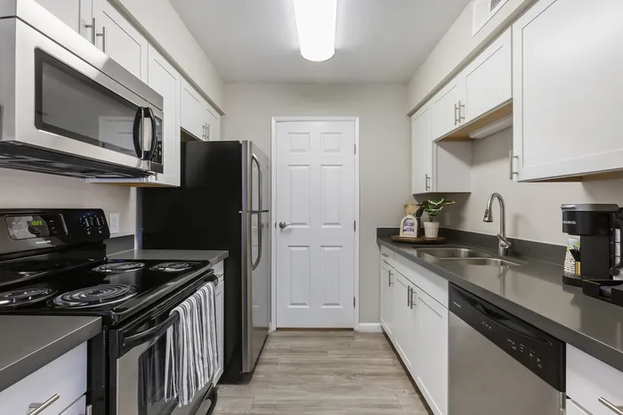 255 North model kitchen with modern appliances and stylish cabinetry in Tucson AZ luxury apartment