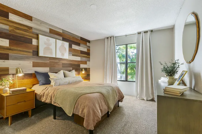 255 North model bedroom with warm wood accents and stylish mid-century modern design in Tucson AZ
