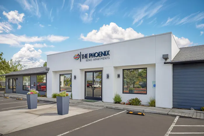 The Phoenix Reno leasing office exterior with modern architecture and vibrant landscaping in Reno NV