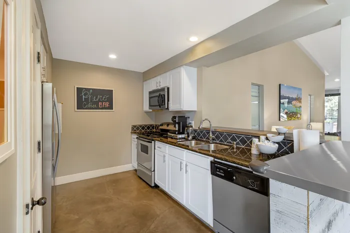 The Phoenix Reno leasing office kitchen with stainless steel appliances and coffee bar ambiance in Reno NV