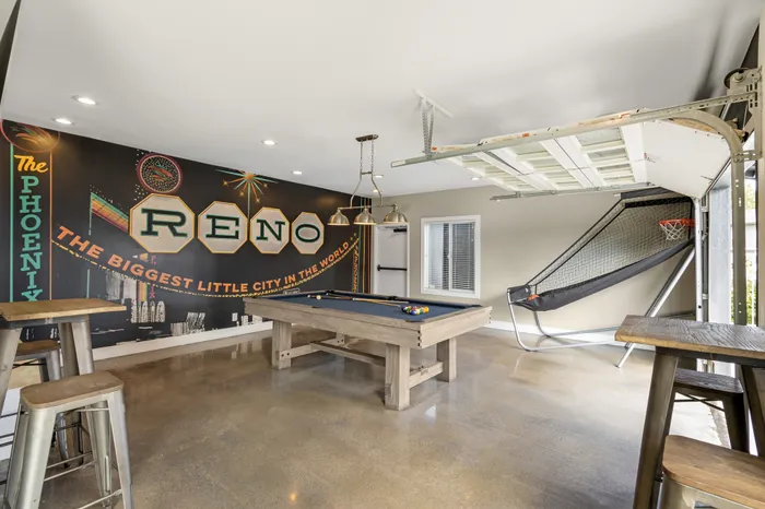 The Phoenix Reno game room with pool table, Reno wall mural, and basketball arcade game in Reno NV