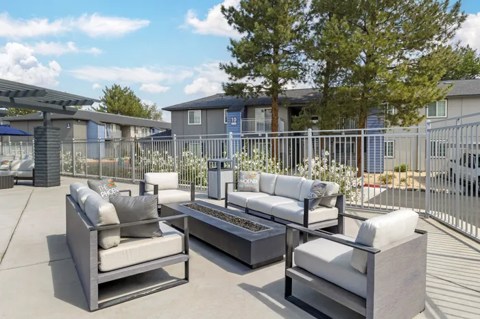 The Phoenix Reno outdoor pool lounge with modern seating and cozy fire pit in Reno NV