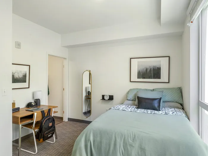 Republic on Main spacious bedroom with work desk and queen sized bed in Moscow, ID