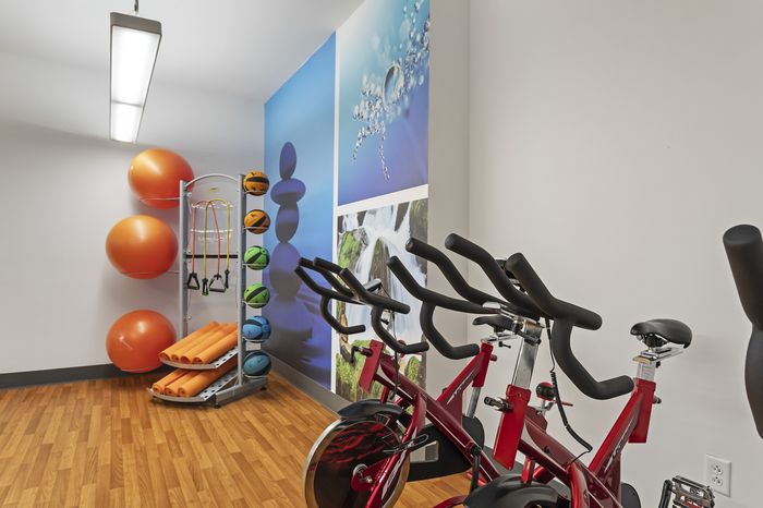 303 Flats bright and open yoga studio with hardwood floors and mirrored walls in Knoxville Tennessee