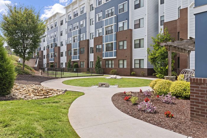 303 Flats modern apartment building exterior with controlled access entry in Knoxville Tennessee