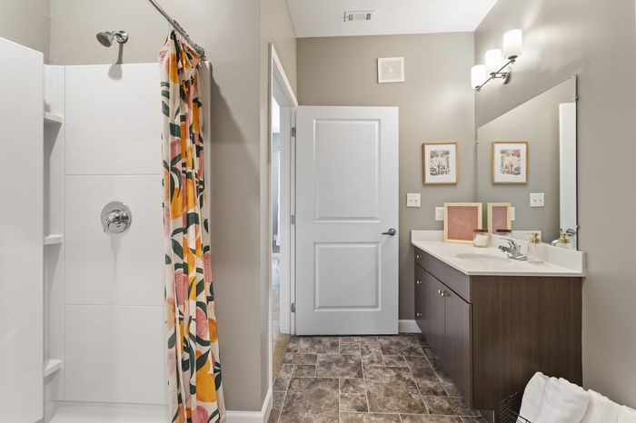 303 Flats renovated model bathroom with modern vanity and clean contemporary finishes in Knoxville TN