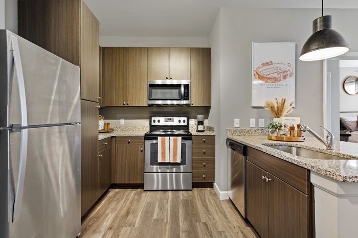 303 Flats model kitchen with stainless steel appliances and sleek cabinetry in Knoxville TN