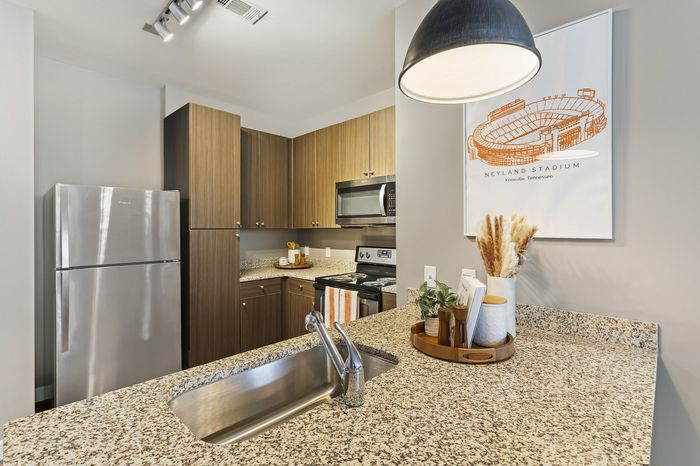 303 Flats fully equipped kitchen with modern finishes and open layout in Knoxville Tennessee student housing