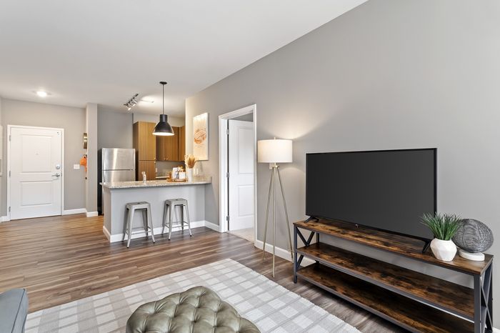 303 Flats student apartment living area with modern decor and comfortable community-style layout in Knoxville TN
