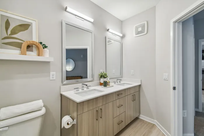 Modern bathroom with upscale fixtures and tile at Niche luxury apartments in Tampa, FL
