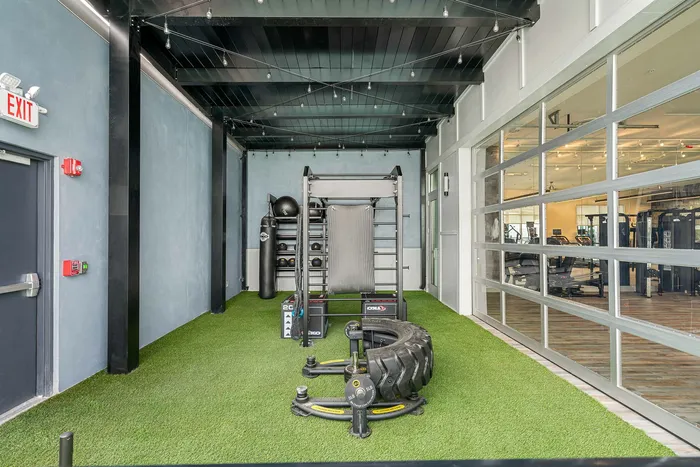 High-end fitness center with cardio and strength equipment at Niche luxury apartments in Tampa, FL