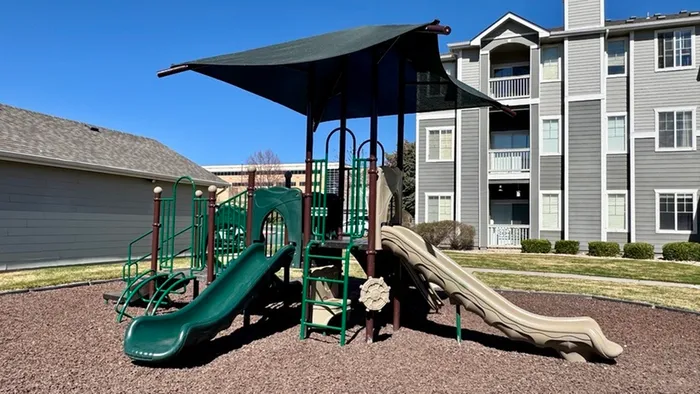 Kids playground at Pinnacle Mountain View apartments in Clearfield UT