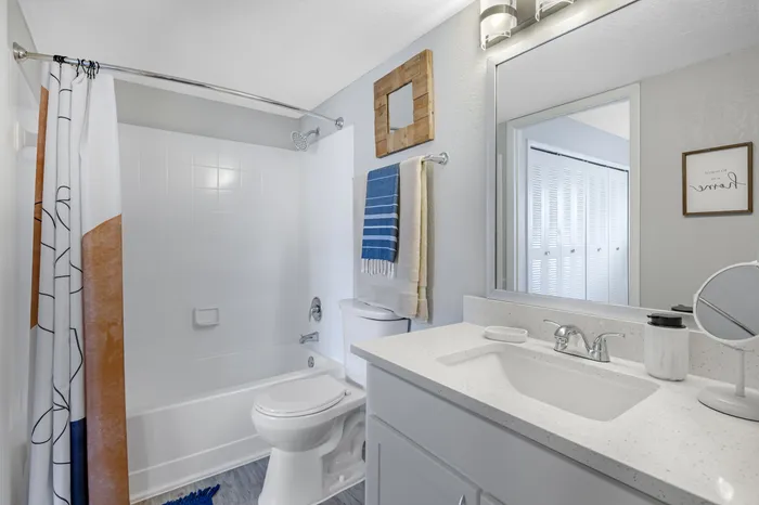 The Phoenix Orlando apartment interior bathroom with large mirror, plenty of counter space and medicine cabinet
