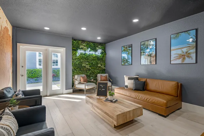 The Phoenix Orlando Collaboration Center and community lounge with several couches and chairs.