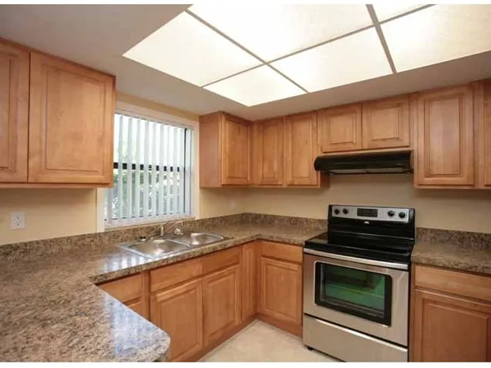 Marcell Gardens Apartments, interior, kitchen, peninsula counter, stainless steel appliances,