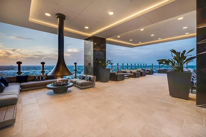 24th floor outdoor lounge with floating fireplace, lounge seating, grilling stations and firepits
